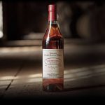 one bottle of pappy van winkle with a blurry background