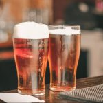 louisville brewery: two glasses of beer on a bar