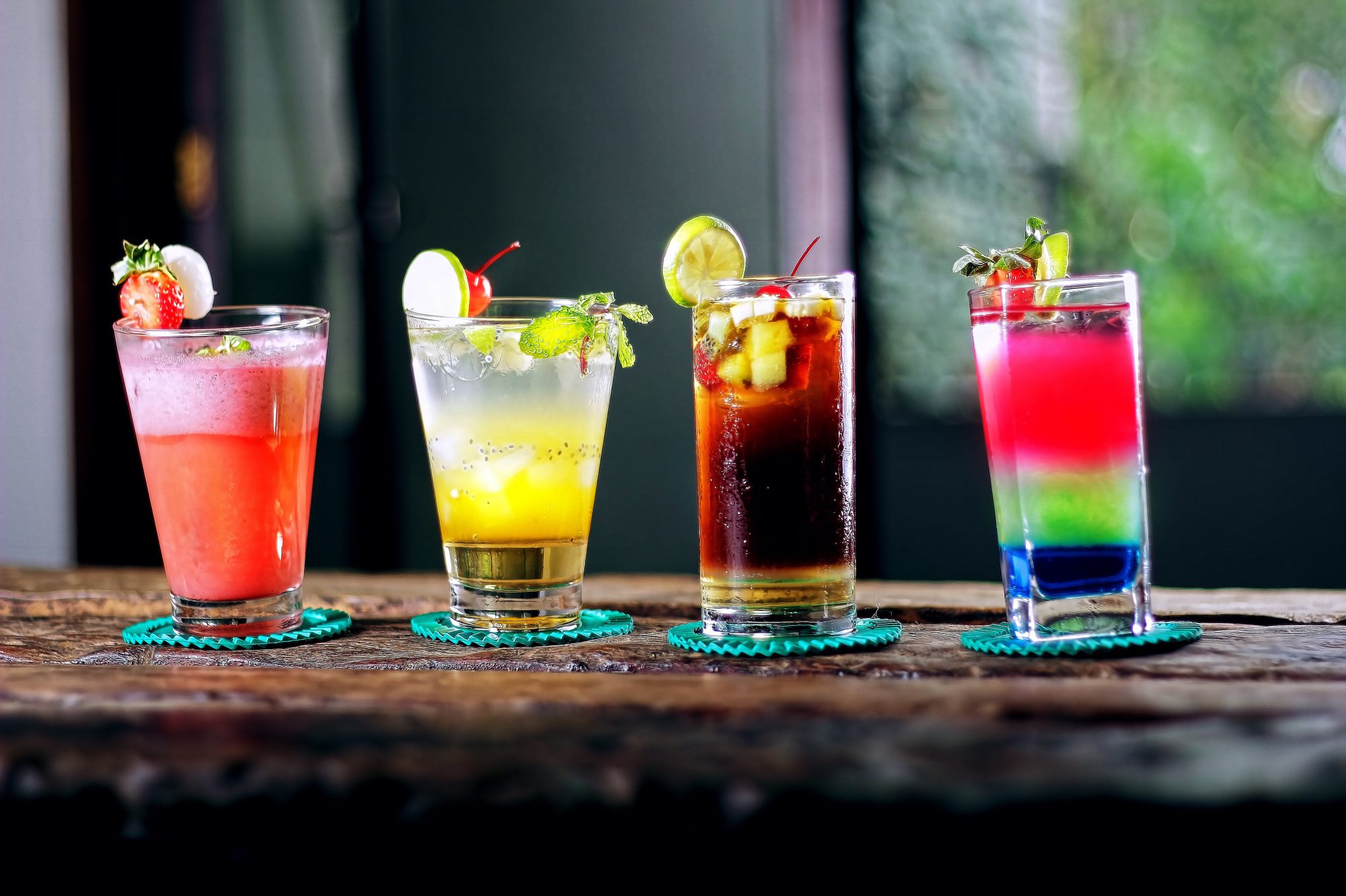 drink for you: 4 colorful cocktails on a wooden bar