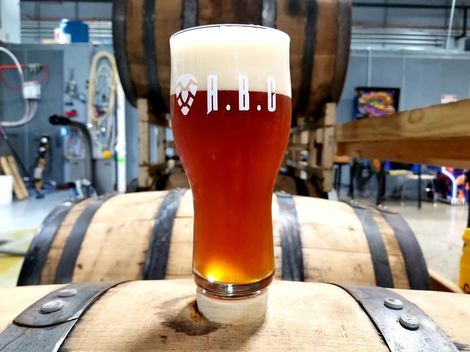 Kentucky Brewing Company: glass of beer that says abc on a barrel