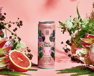 Sparkling Cocktail: a pink can with a grapefruit and flowers surrounding it and a pink background